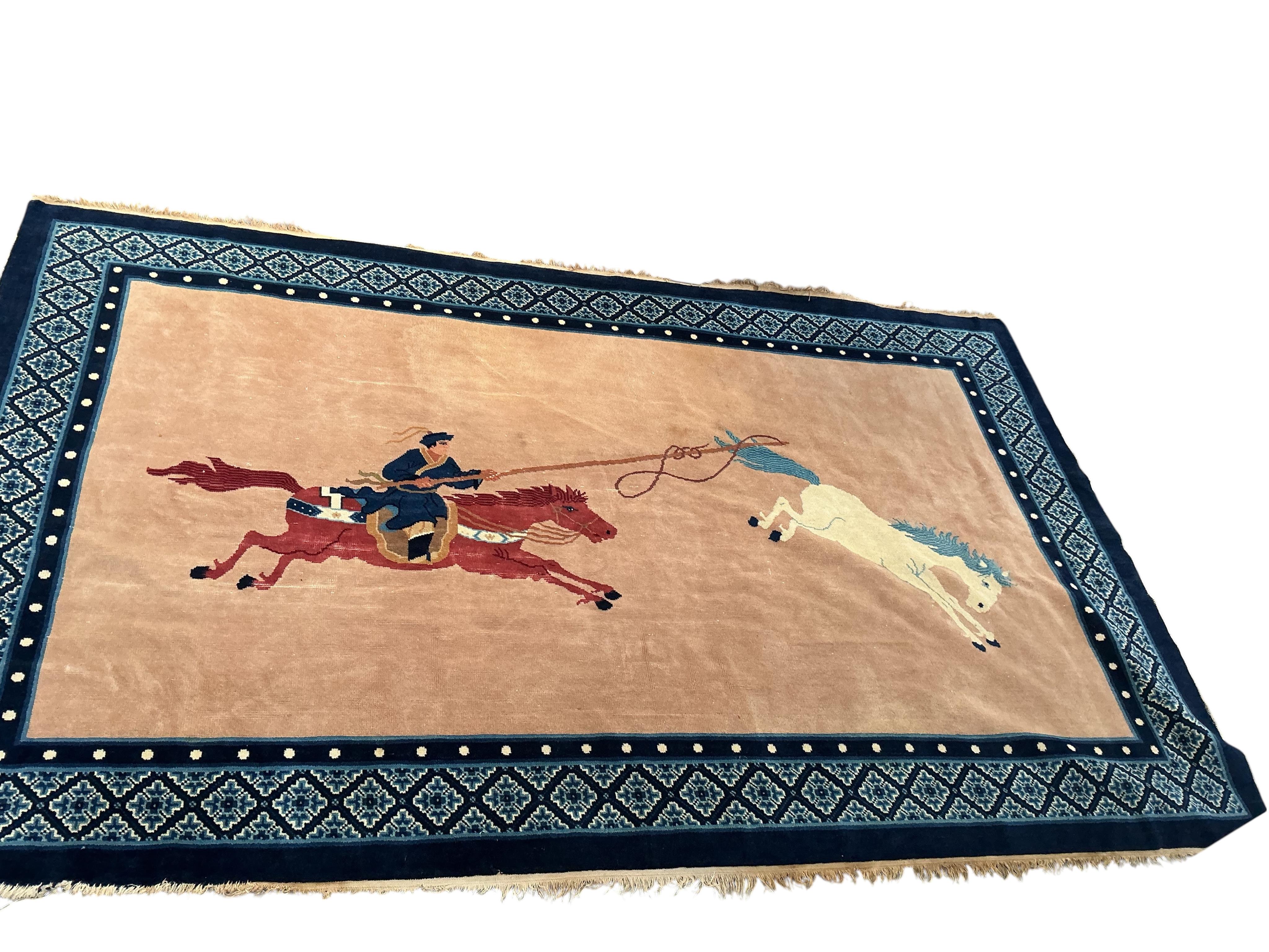 An early 20th century Chinese fawn ground rug, retailed by Liberty and Co, 248 x 154cm.